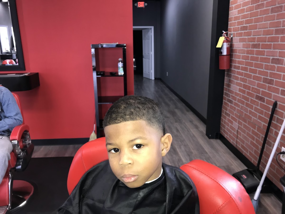 Inside TAY'S Cut Above The Rest Barbershop — barber chairs and a clean, welcoming shop